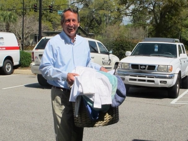 Sanford held a press conference at a dry cleaners, so he brought some clothes along.