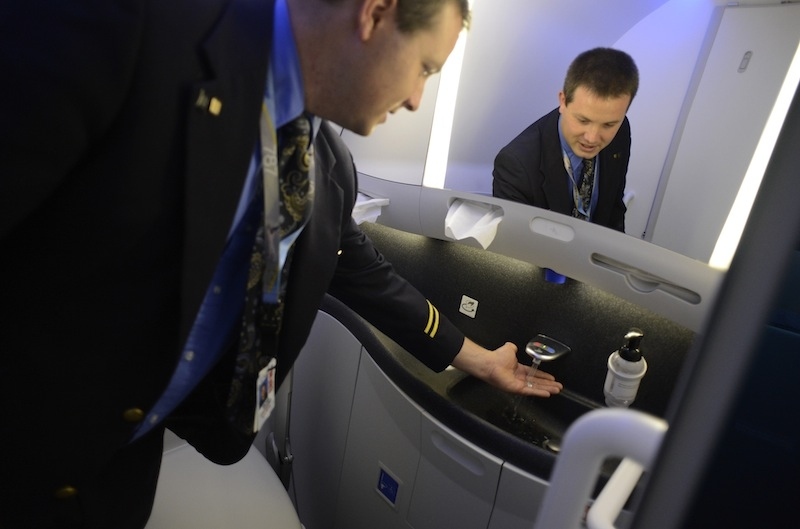 Some planes, like the Boeing 787 Dreamliner, even have hands-free sinks.