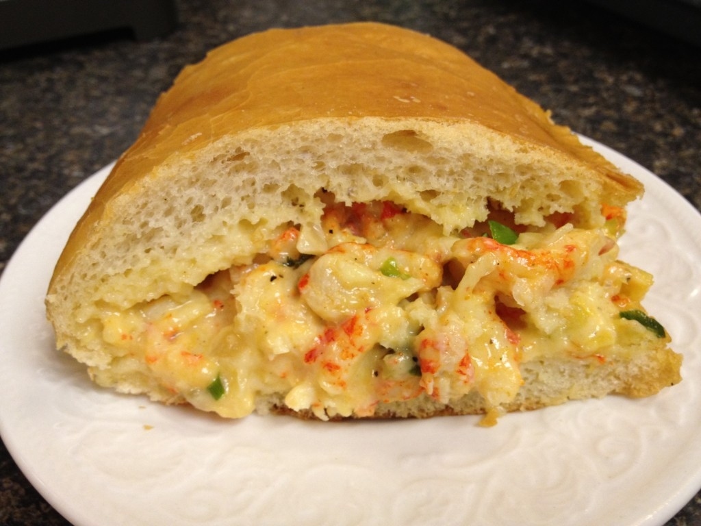 Crawfish bread? This sandwich, usually only available during Jazzfest, is made of French bread, crawfish, bell pepper, onion, celery, and a dab of mayo. You can seasonally make your own at the New Orleans School of Cooking, so get a group of friends together and schedule a time to make this melty, delicious meal!