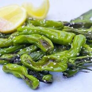 With a quick stir-fry and a dash of spice from sesame and smoked paprika, shisitios are a great starter or cocktail party nibble.