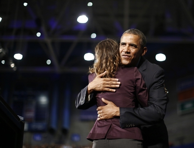Obama hugs Silvana D'Ettorre, who introduced him to deliver remarks at the University of Buffalo.