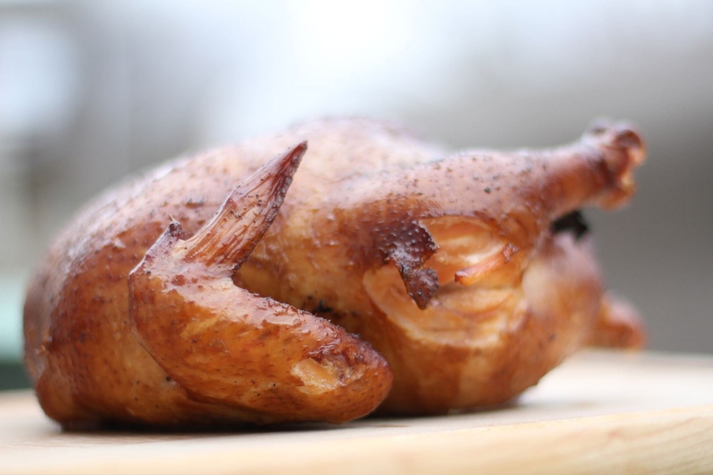 If you can bear to wait for an extra 3 to 5 hours longer while grilling, move the bird to an area of indirect heat and wait. Recipe here.