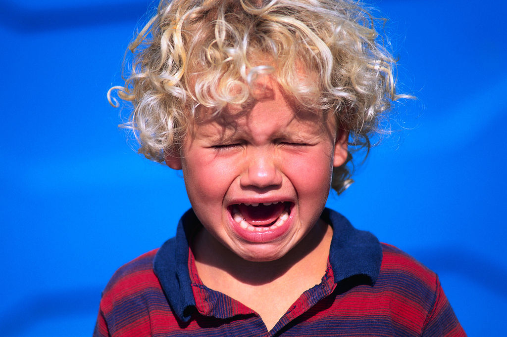 Whether they're screaming through your nap, throwing sand, or abandoned by their idiot parents, kids are can easily ruin a peaceful beach day.