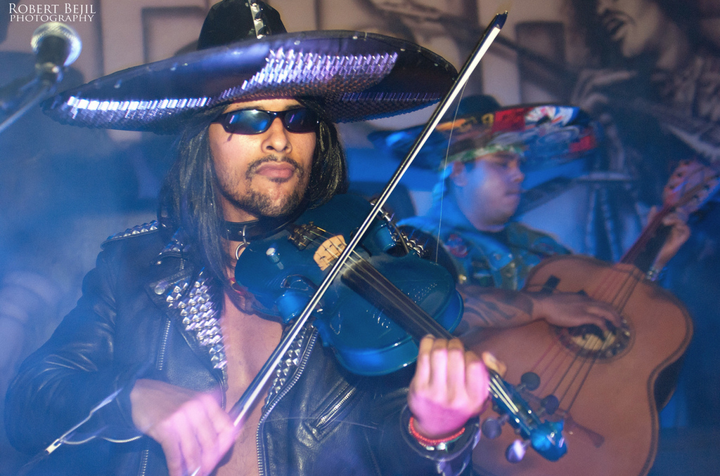 Metalachi is an ingenius metal-mariachi cross genre explosion that covers Black Sabbath and Metallica. They use a rock violin that is blue. (And check out his sunglasses).