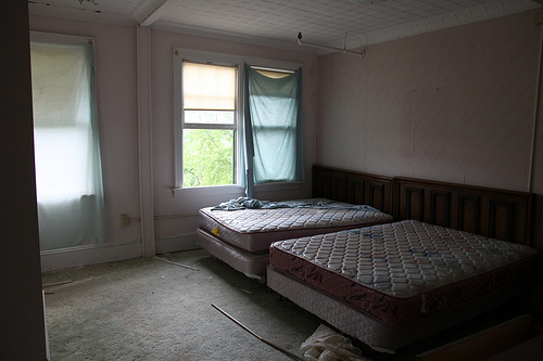 Using discarded sheets as window coverings was inventive ...