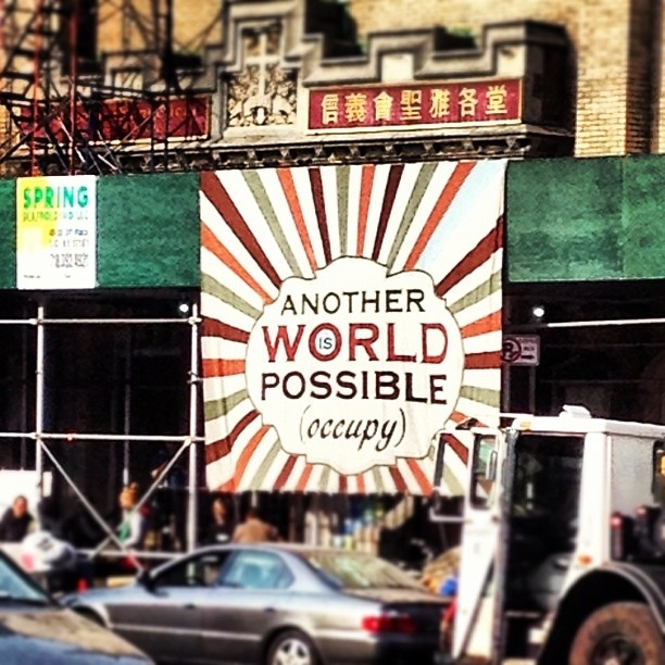 A banner with a popular Occupy rallying cry hangs on the front of the first Occupy Sandy hub, St. Jacobi Church in Brooklyn.