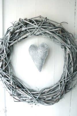Simply spray-paint a wreath of dried branches. For an added touch, hang a felt pillow or a pinecone in the center.