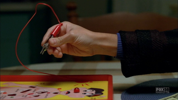 FOX's Fringe is known for dropping all sorts of fun Easter eggs in its shows - this brief scene showing the characters playing Operation was a direct reference to later episodes in the season in which a man with robotic insides was carefully operated on.