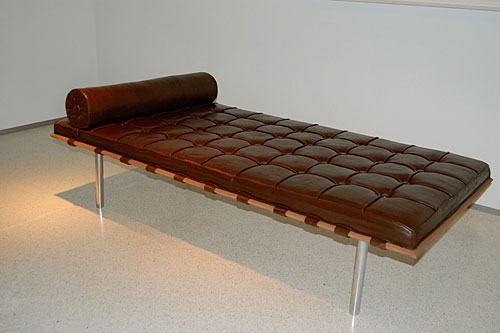A life-size replica of a Mies van der Rohe Barcelona couch, but as a chocolate cake.
