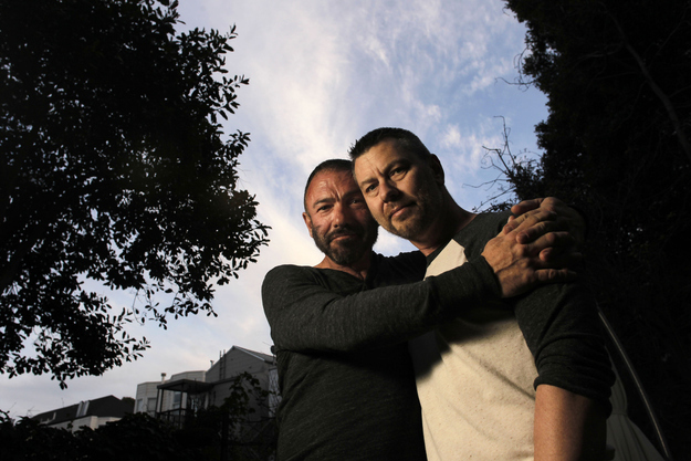 Bradford Wells, left, and Anthony John Makk pose together at their home in San Francisco. Wells and Makk are a married gay couple that have lived most of their 19 years of relationship in San Francisco, but Makk faced deportation because he is an Australian citizen.