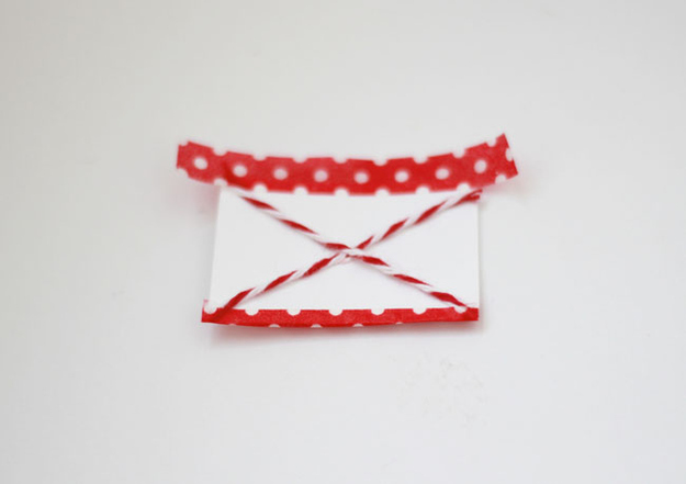 Now you have what looks like a little letter; all you need is the love part. Using a scrap piece of felt, cut out a little heart and glue it onto the center of your love note.