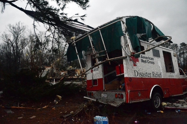 A trampoline rests on top of a damaged American Red Cross disaster relief truck outside of the Hattiesburg American Red Cross.