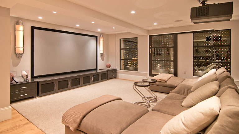 Yes, that is a wine cellar in the back of the theater. And no, you're not drinking alone if it's with a projection of Joseph Gordon-Levitt.