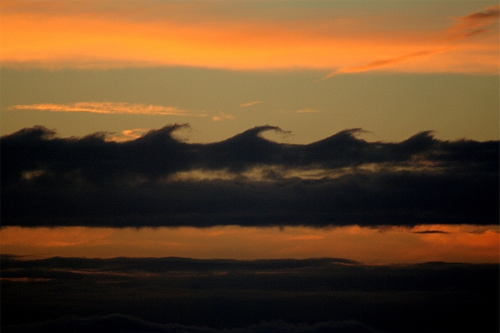 Referred to as "the oil and vinegar" of clouds, two clouds of different densities collide to form cartoon-like waves—this happens because the lighter part is whipped upwards while the denser part is stuck at a slower speed.