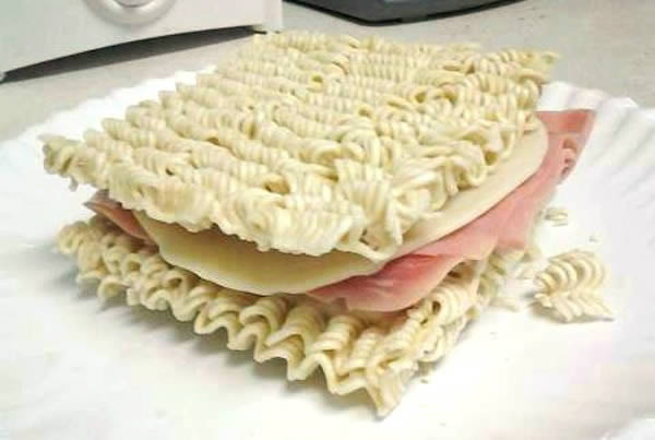 Stick some unidentifiable ham and cheese product between two uncooked ramen noodles packets. Mmmm crunchy.