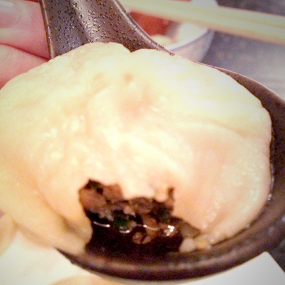 Fill soup spoon with a little black vinegar and thinly sliced ginger. Then top with the soup dumpling. Your gele stock has now transformed into the best part of soup dumplings! Enjoy.