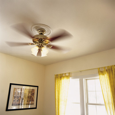 A fan, which costs two to five cents per hour to operate, will make a room feel 4 to 6 degrees cooler. Also, a fan works well in tandem with an air conditioner because the dehumidifying action of the air conditioner provides drier air that the fan can then move around.In frequently used rooms, install a ceiling fan (set it to spin counterclockwise in summer). You'll save the most money by running the fan only when you're in the room. A motion-detector switch (around $20), which turns the fan on when you enter a room and off when the room is empty, is a good addition. However, if you have pets that move in and out of the room, make sure the switch can be turned off manually. Otherwise, your pets can cause the fan to run while you're away.Cost: Ceiling fans range from $40 to $300 or more. Floor fans cost around $20, and whole-house fans run from $300 to $600.Benefit: Ceiling fans can decrease your cooling bill by up to 15 percent, while a whole-house fan can slash it by 50 percent.RELATED: How to Install a Ceiling Fan