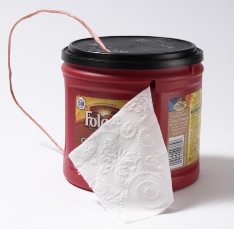 Repurpose a coffee can to hold and protect TP.