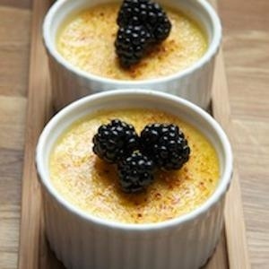 Sweet, naturally creamy corn lends unmistakable flavor, perfectly paired with tart blackberries, and luscious texture to creme brulee.