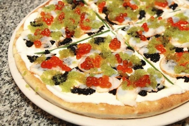 This pizzeria features a $1,000 pizza, topped with lobster tails and four different types of caviar. Holy Cannoli!