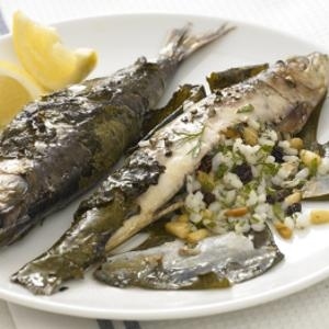 Grape leaves hold in a stuffing of rice, pignoli & plenty of herbs, which soaks up tons of flavor from its sardine hideaway!