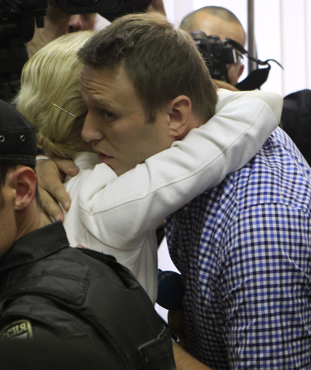 Russian protest leader Alexei Navalny embraced his wife Yulia after the verdict.