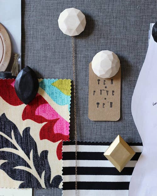 You can basically glue anything to regular pushpins to create the bulletin board of your dreams!Learn how to create this chunky gem version here.