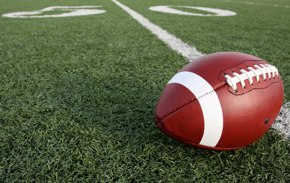 Football is a derivative of rugby football which itself was a derivative of football (soccer). Football could have easily been called rugby in its early years, but in 1876, the term "football" was established for the college football season. Outside of the US, the sport is simply known as "gridiron" or "American football."