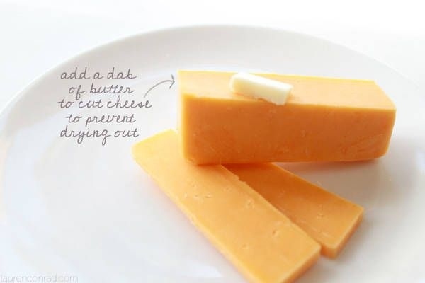 Add a dab of butter to the cut ends of cheese.