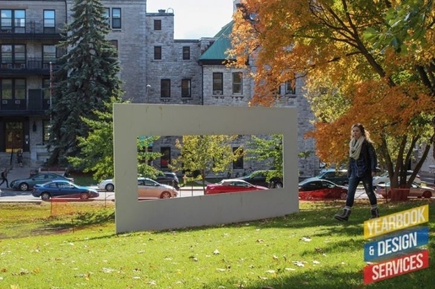The "Big White Frame" is actually constructed out of steel in 1978 by Canadian artist Peter Kolisnyk and the frame was originally installed at Harbourfront in Toronto. Passersby were able to stop and see Lake Ontario and the surrounding harbour through its frame. Read this if you're curious.