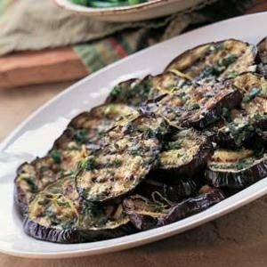 Like a gremolata, the sauce here is an herb minced with lemon zest and garlic. It's then drowned in olive oil and drizzled over charred rounds of smoky eggplant.