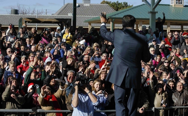 Republican presidential nominee Mitt Romney waves to the overflowing crowd after delivering a speech in West Allis, WI, November 2, 2012.
