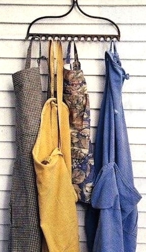 What better way to add a little country flavor to your home. Use the teeth of the rake to hang kitchen aprons.