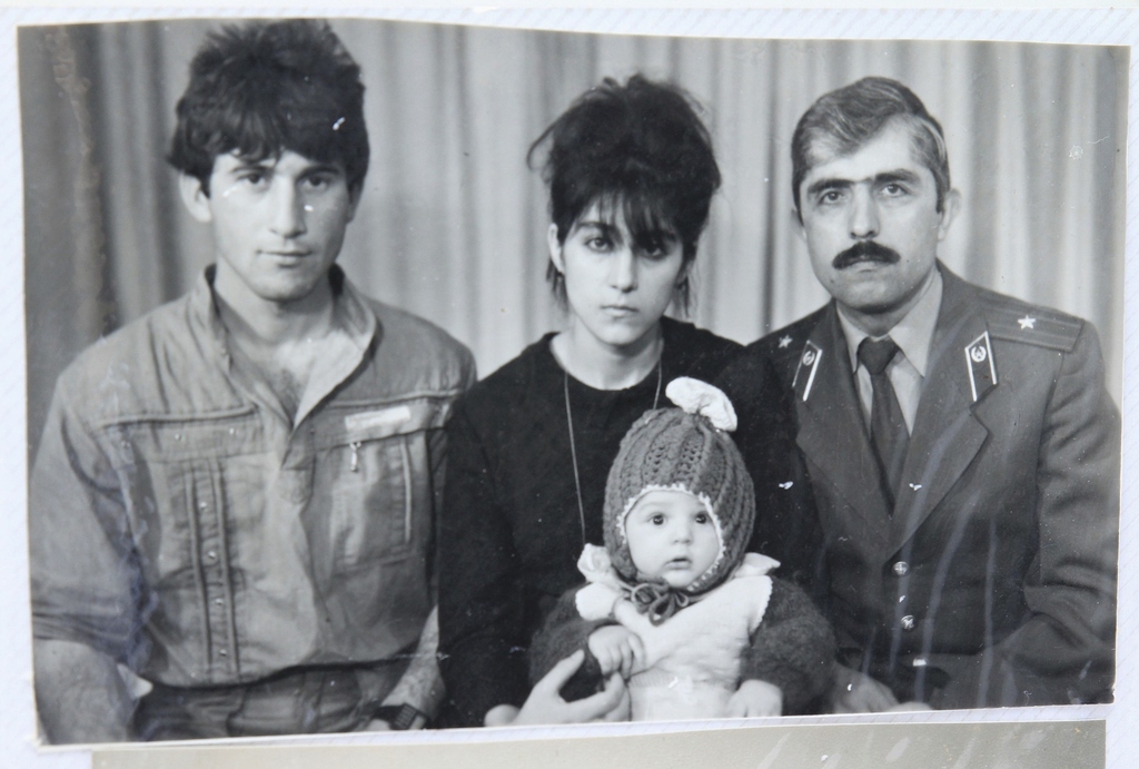 Tamerlan Tsarnaev (center, bottom), accompanied by his father Anzor (left), mother Zubeidat, and uncle Muhamad Suleimanov (right).