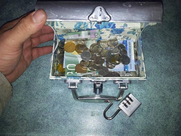 I just dumped a bunch of change into a dollar store box I painted silver. I also added in a $20 and a $5.