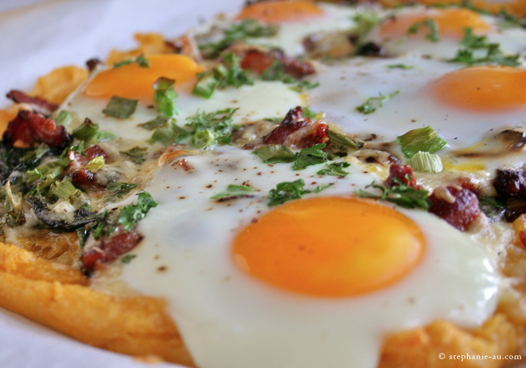 It is nothing short of Heaven on Earth. It is delicious and nutritious. This scrumptious example includes eggs, bacon and spinach on a polenta crust.