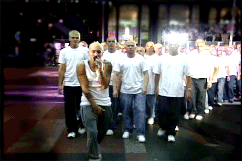 Eminem performed at the 2000 VMAs with a swarm of look-a-likes. "The Real Slim Shady" started outside the Radio City Music Hall on 6th Avenue in Manhattan. Eminem continued his performance into the arena and was followed by a hundred Eminem 'clones' wearing white tank tops and baggy jeans with dyed bleach blonde hair.