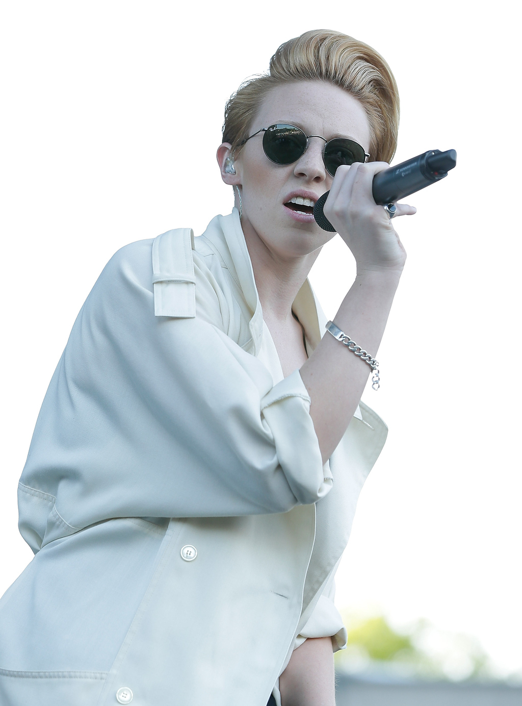 This outfit must be her visceral reaction to all the bra-wearing, arm party-rocking crazies running around at all her shows nowadays. Also possible: she's the new Tilda Swinton and she knows it.