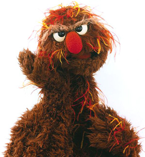 Hey, kids: What's more fun than a Grouch in a trash can? How about this Grouch who lives in a junk car on Israeli Sesame Street? Oofnik!