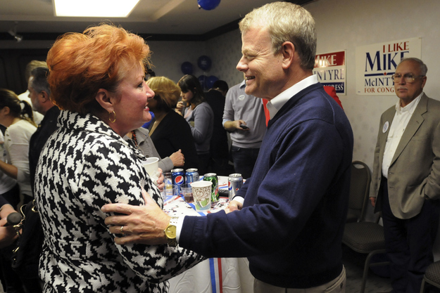 Rep. Mike McIntyre talks with a supporter on Election Day 2012.