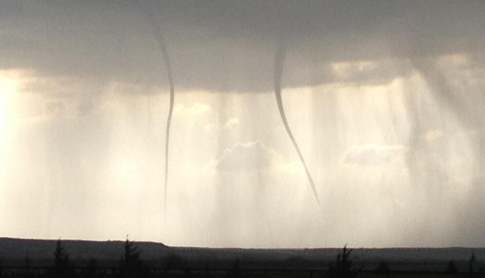 Two funnel clouds photographed near Hays, Kansas.