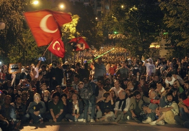 Turkish protesters wave Turkish flags during a massive rally on John F. Kennedy Street near the U.S. Embassy in Ankara, Turkey.