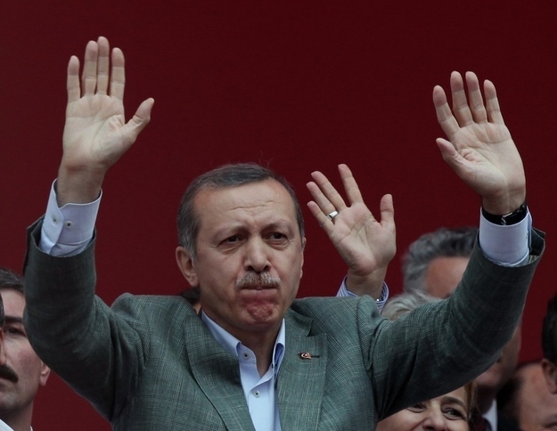 Turkish Prime Minister Recep Tayyip Erdogan salutes supporters during a party rally outside Ankara.