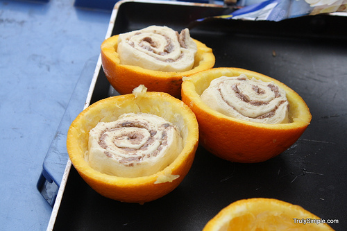 Cook cinnabuns (the canned kind) in a hollowed-out orange over a campfire.