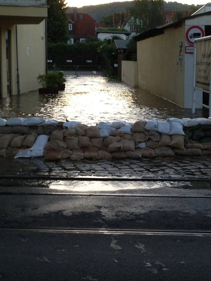 Sandbags, which have been packed by hand. I've seen photos of children, and heard stories of a man in a wheelchair packing sandbags.