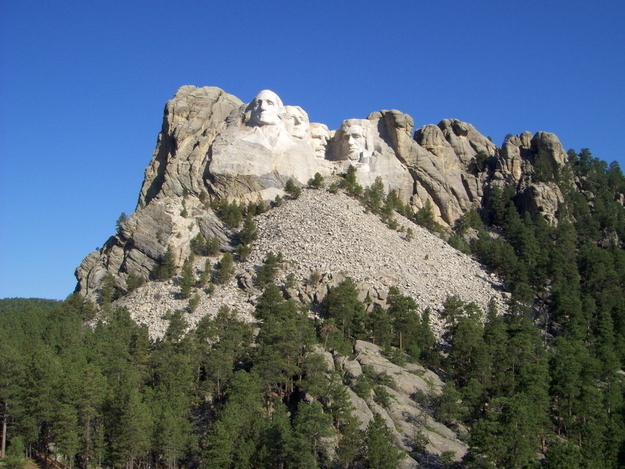 The carving of four, 60-foot faces began in 1927 and ended in 1941. This national memorial immortalizes presidents Washington, Jefferson, Roosevelt, and Lincoln in granite.