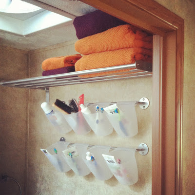 Use these compartmentalized hanging containers from Ikea for toiletries.