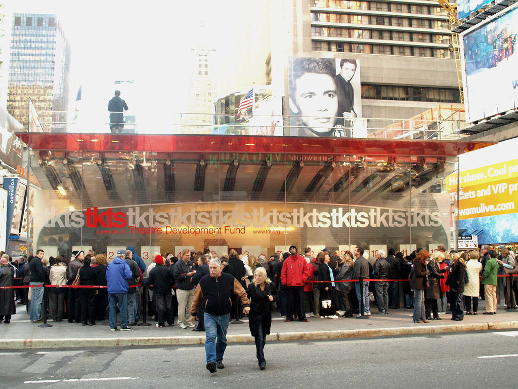 It's counter-intuitive, I know. But the lines in front of TKTS scarlet-red booth stairs are terrible; they grow longer and longer and longer. So the execs who run the TKTS booth are offering a time-saving salve for people with less money to burn. It is called a fast pass. (Cumbersome crypto-name: TKTS 7-Day Fast Pass). It is designed to allow patrons to skip the lines at the booth if they have already made a TKTS purchase. All they need to do is bring the TKTS stub to the booth within seven days of that ticket’s date. Walk up to Window No. 1 to secure those same-day discounts. Patrons avoid the horribly long lines if they are hungry to see more shows or invite more family and friends to accompany you. (They can buy tickets for future shows at Window No. 1, too, but they pay full price).The Theater Development Fund (aka TDF), which operates the TKTS booth, feels that this incentive will help visitors who are in town for a limited period of time to see more shows during their trip.