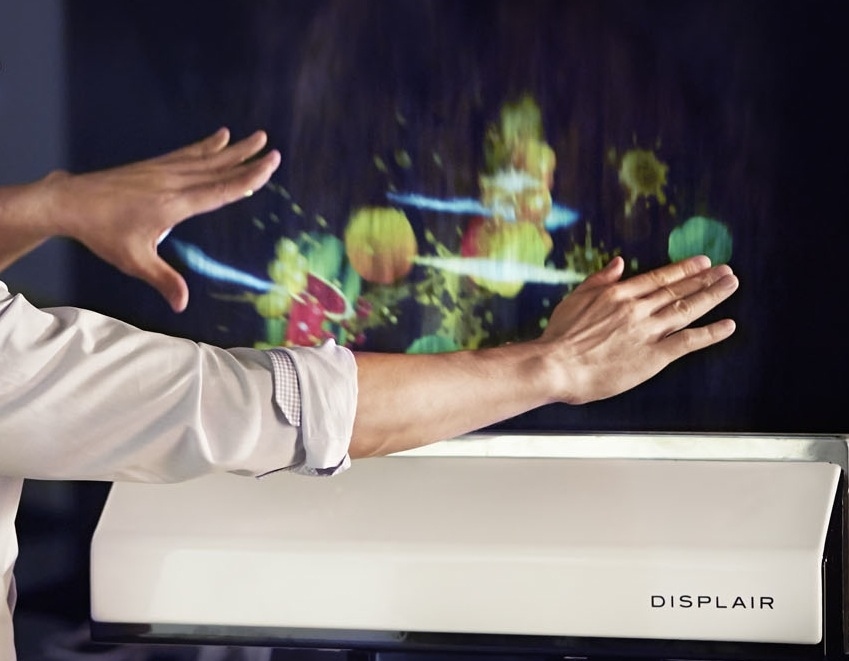 Reach out and touch your favorite show. Check out this new TV prototype. It uses a ultra-thin stream of water droplets as its surface, opening the door to an interactive viewing experience.