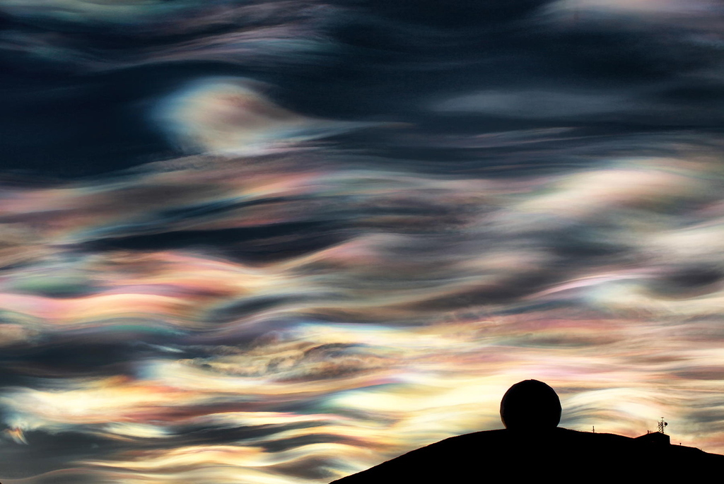 Due to their high altitude and the curvature of the surface of the Earth, these clouds will receive sunlight from below the horizon and reflect it to the ground, shining brightly well before dawn or after dusk.